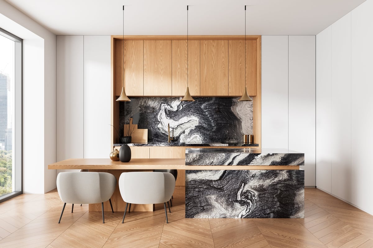 Contemporary kitchen with wood panel cabinets, marble island and elegant design